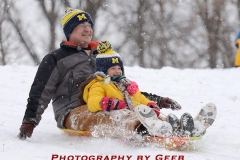 Steve and Maya having fun sledding